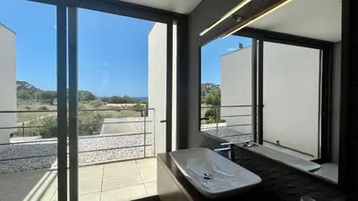 a bathroom with a sink and a large window at Passion by Check-in Portugal in Albufeira
