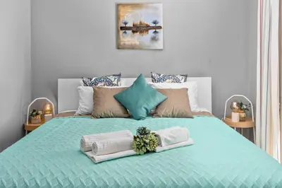 a bed with towels and towels on top of it at Seaview Penthouse in Algarve with Spacious Terrace in Quarteira