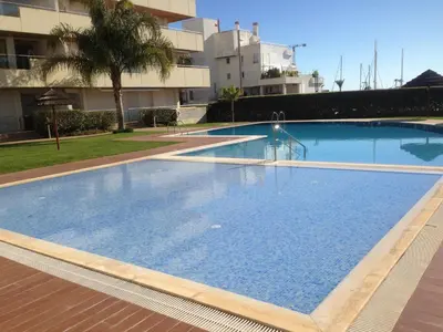 a large swimming pool in the middle of a building at Marina Vilamoura Aquamar 104 By Vilamoura Sun in Vilamoura