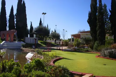 a golf course with green grass and trees at Marina Vilamoura Aquamar 104 By Vilamoura Sun in Vilamoura