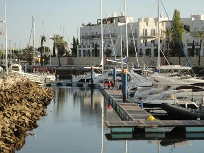 a large swimming pool in front of a building at VilamouraSun Aquamar 518 - Fantástico Vista in Vilamoura