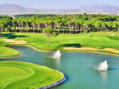 an aerial view of a golf course with a pond at Amendoeiras I - Central Vilamoura in Vilamoura