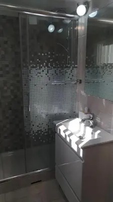 a bathroom with a shower and a sink and a shower at Apt Cardoso 3 ao lado da Praia Peneco in Albufeira