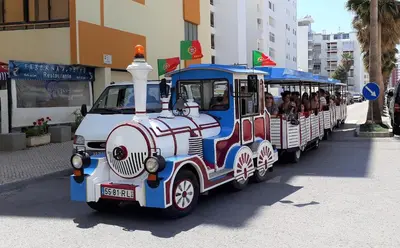 a small train with people riding on it at T1 Praiamar 3 Vista Fabulosa in Quarteira