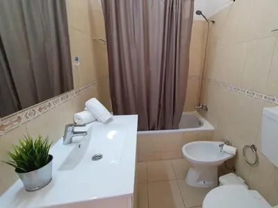 a bathroom with a sink and a toilet and a shower at T1 Praiamar 3 Vista Fabulosa in Quarteira