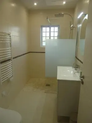 a white bathroom with a sink and a mirror at VIVENDA L'OLIVIER in Quarteira