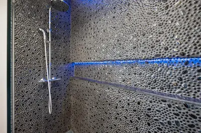 a shower in a bathroom with lots of bubbles at Renovated Vilamoura Penthouse Near Marina & Beach in Vilamoura