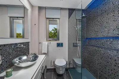 a bathroom with a sink and a shower at Renovated Vilamoura Penthouse Near Marina & Beach in Vilamoura