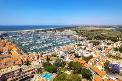 an aerial view of a city with a marina at Renovated Vilamoura Penthouse Near Marina & Beach in Vilamoura