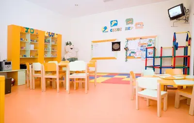 a classroom with tables and chairs and a tv at Vila Gale Marina in Vilamoura