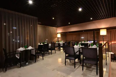 a dining room with tables and chairs in a restaurant at Vila Gale Marina in Vilamoura