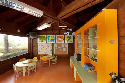 a classroom with tables and chairs in a building at Vila Gale Cerro Alagoa in Albufeira
