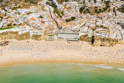 an aerial view of a beach with crowds of people at Hotel Sol e Mar Albufeira - Adults Only in Albufeira