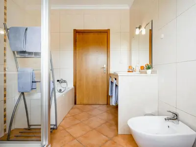 a bathroom with a tub and a sink and a toilet at Villa Villa Pescada by Interhome in Albufeira