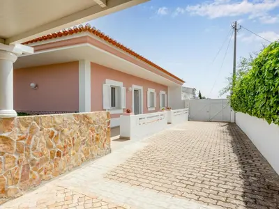 a house with a stone driveway in front of it at Villa Villa Pescada by Interhome in Albufeira