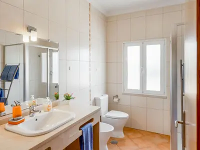 a white bathroom with a sink and a toilet at Villa Villa Pescada by Interhome in Albufeira