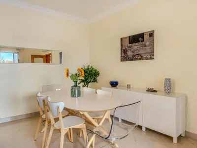 a dining room with a white table and chairs at Villa Colibri by Interhome in Patroves