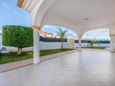 a large hallway with columns and a courtyard with trees at Villa Colibri by Interhome in Patroves