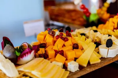 a buffet with cheese and other appetizers on a table at Monica Isabel Beach Club in Albufeira