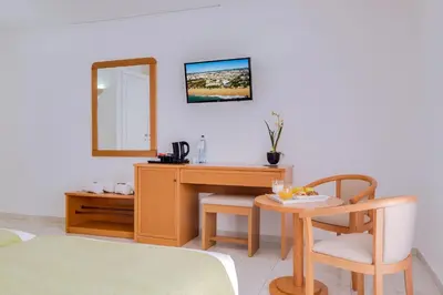 two beds sitting next to each other in a bedroom at Monica Isabel Beach Club in Albufeira