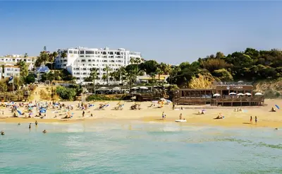 an aerial view of a beach with people in the water at Monica Isabel Beach Club in Albufeira