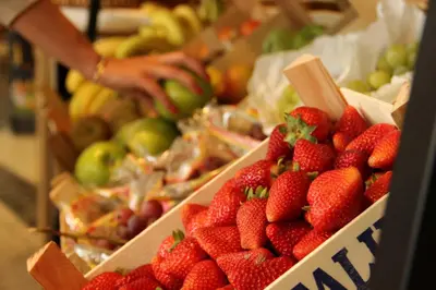a display of strawberries and other fruits in a market at Martinhal Quinta Family Resort in Quinta do Lago