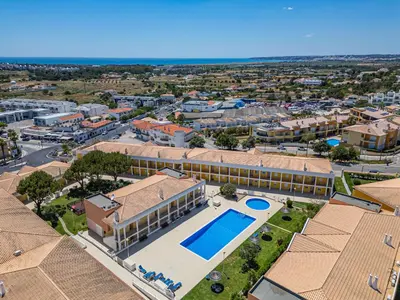 an aerial view of a resort with a swimming pool at Pool&Beach in Encosta de São José in Albufeira