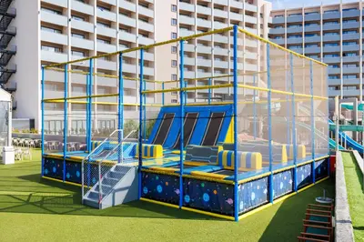 a playground in front of a building at Jupiter Albufeira Hotel - Family & Fun - All Inclusive in Albufeira
