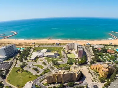 an aerial view of a resort and the beach at Dom Pedro Portobelo in Vilamoura