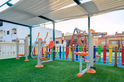 a play area with a playground with a play equipment at Choromar Apartments in Albufeira