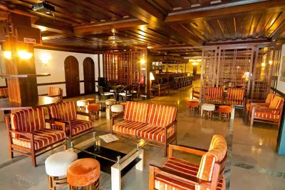 a lobby with couches and chairs and a table at Hotel Balaia Mar in Albufeira