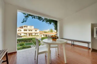 a small kitchen with a sink and a microwave at Muthu Balaia Sol in Albufeira