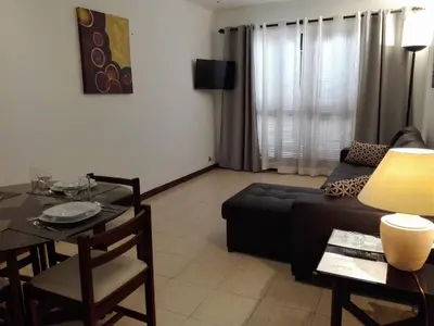 a living room with a couch and a table at Apartamentos da Balaia in Albufeira