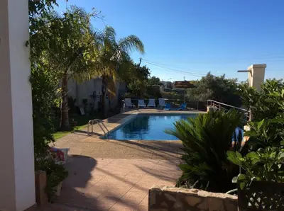 a swimming pool in the backyard of a house at Golda Sol in Loulé