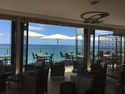 a restaurant with a view of the ocean at Alisios in Albufeira