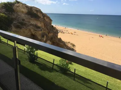 a view of a beach with people on the sand at Alisios in Albufeira