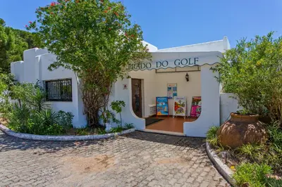 a white building with a tree in front of it at Prado do Golf in Vilamoura