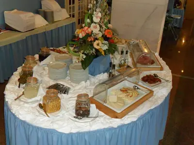 a table with a buffet of food on it at Hotel Apartamento Brisa Sol in Albufeira