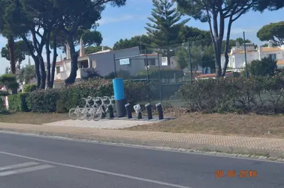 a row of bikes parked on a sidewalk next to a street at Vilamoura-Nautic Apartment in Vilamoura