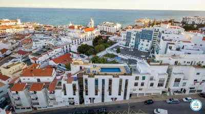 an aerial view of a city with the ocean at Colina do Mar in Albufeira