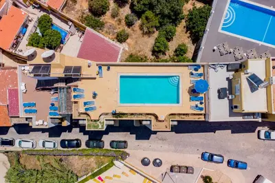 an overhead view of a large building with a swimming pool at Colina do Mar in Albufeira
