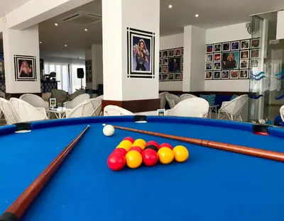 a pool table with balls on top of it at Janelas do Mar Apartamentos Turisticos in Albufeira