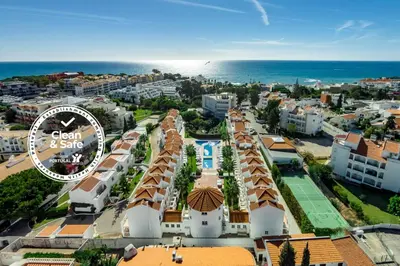 an aerial view of a city and the ocean at Club Ouratlantico in Albufeira