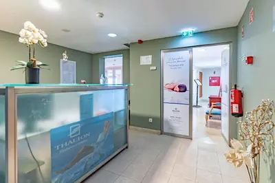 a hospital room with a reception counter and a door at Boa Vista Hotel & Spa - Adults Only in Albufeira