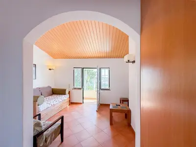 a living room with a couch and a table at Oleandro Country Club in Albufeira