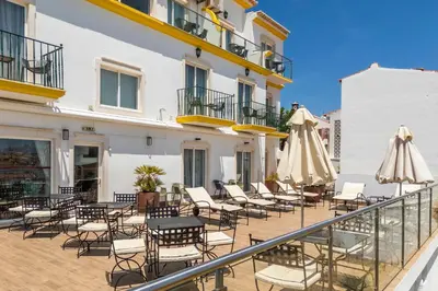 a restaurant with blue chairs and tables at Vila Sao Vicente Boutique (Adults Only) in Albufeira