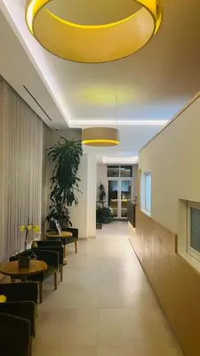a lobby with a large yellow ceiling at Hospedaria Frangaria in Faro