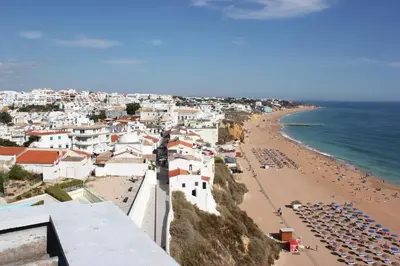 a view of a beach and the ocean at Rocamar Exclusive Hotel & Spa - Adults Only in Albufeira
