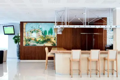 an office lobby with aania bulka sign on the wall at Santa Eulalia Hotel & Spa in Albufeira