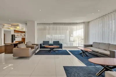 a sauna with wooden walls and benches and a light at Santa Eulalia Hotel & Spa in Albufeira